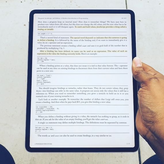 A photo of an iPad Pro 2018 model with a book opened in MapleRead app